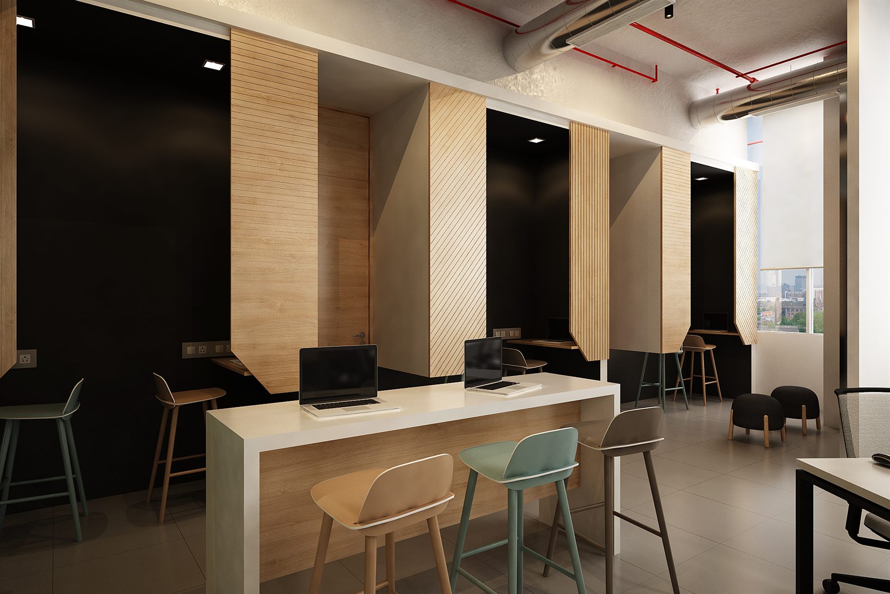 Top-down view of workstation pods, timber study booths along one wall and lime lounge chairs around the coworking floor