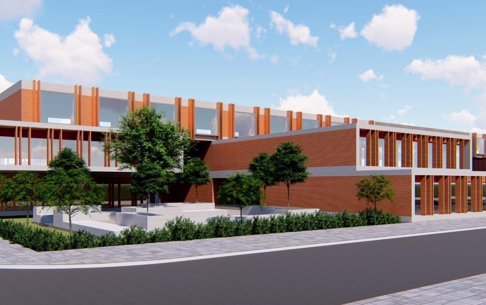 Render of the Juna Deesa institute's long, low red-brick academic block fronted by landscaping.