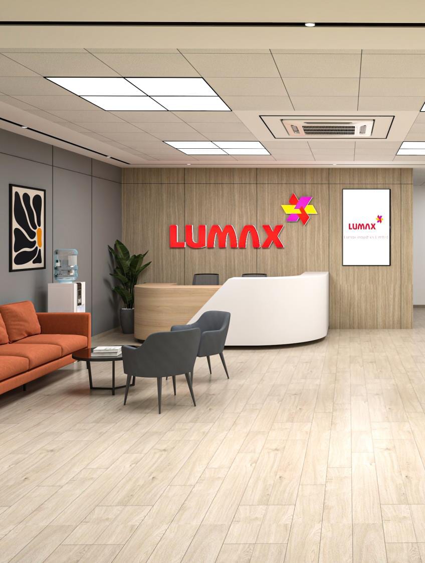 Fitted-out reception carrying the red Lumax branding in the new Gurgaon office building.