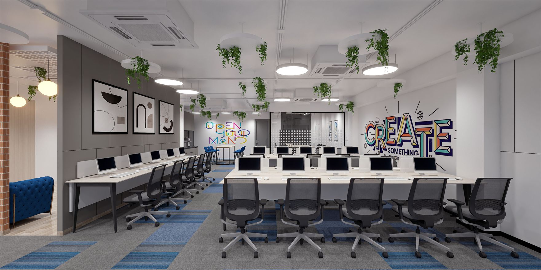 Training floor lined with computer desks under a colourful CREATE SOMETHING mural and trailing ceiling plants