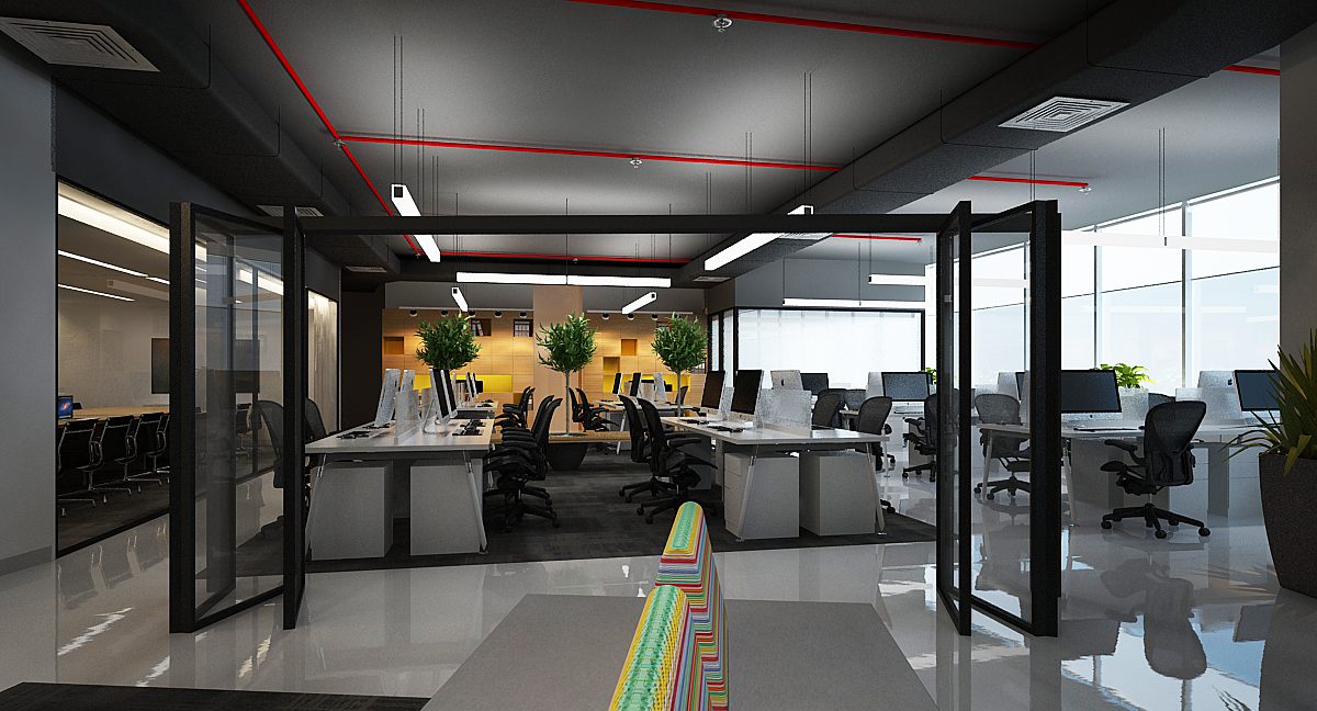 Open-plan floor framed by black folding glass partitions, leading to workstations and a meeting room with greenery.