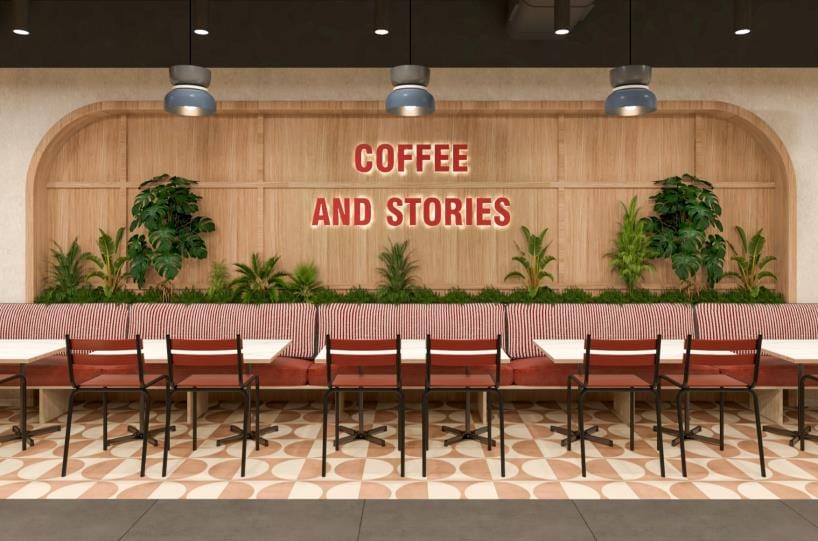 Cafe counter with a coffee-bar sign on an arched wood-slat backdrop and a row of bar stools.